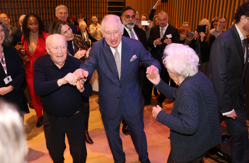  King Charles dances with Holocaust survivors at a pre-Hanukkah event in JW3, London. (photo credit: IAN VOGLER/POOL VIA REUTERS)
