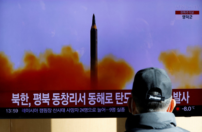  A man watches a TV broadcasting a news report on North Korea firing a ballistic missile off its east coast, in Seoul, South Korea, December 18, 2022. (photo credit: REUTERS/HEO RAN)