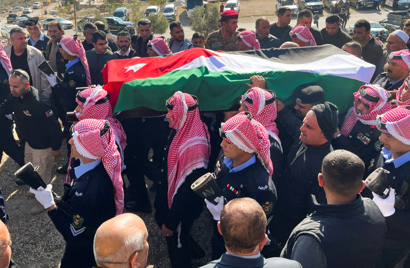  Jordanian security personnel carry the coffin of senior police officer who was killed in riots on Thursday night according to authorities, in Jerash, Jordan December 16, 2022. (photo credit: REUTERS/JEHAD SHELBAK)