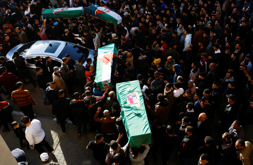 Mourners attend the funeral of 8 people, who died when a ship carrying migrants drowned offshore Tunisia in October, in Rafah, in the southern Gaza Strip, December 18, 2022. (credit: REUTERS/IBRAHEEM ABU MUSTAFA)