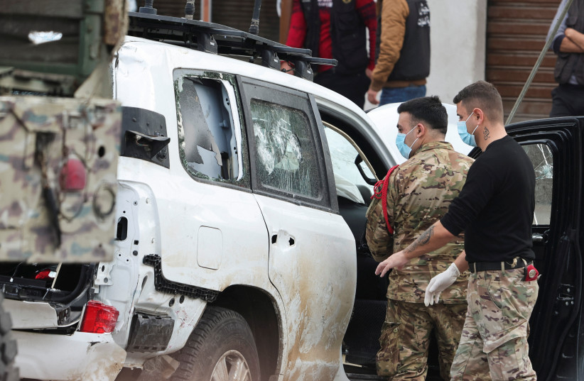  Lebanese army members stand near of what witnesses stated to be the UNIFIL vehicle that was carrying the Irish soldier who was killed on a U.N. peacekeeping Patrol, in Al-Aqbieh, south Lebanon December 15, 2022 (photo credit: AZIZ TAHER/REUTERS)