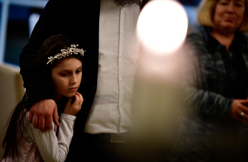  Hasidic Jewish refugees from Ukraine celebrate the first day of Hanukkah at a kosher shelter on the banks of Hungary's Lake Balaton in Balatonoszod, Hungary December 18, 2022. (credit: REUTERS/MARTON MONUS)