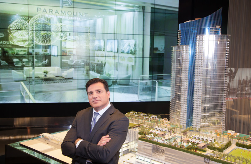  Daniel Kodsi, CEO, Royal Palm Companies real estate development firm standing next to scale model of his Paramount Miami Worldcenter tower. (credit: Bryan Glazer | World Satellite Television News)