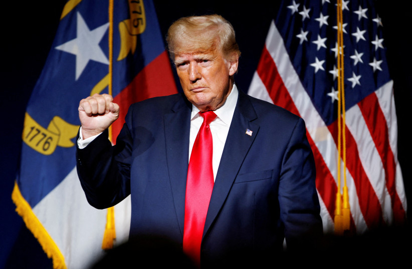 Former US President Donald Trump makes a fist while reacting to applause after speaking at the North Carolina GOP convention dinner in Greenville, North Carolina, US June 5, 2021.  (photo credit: JONATHAN DRAKE / REUTERS)