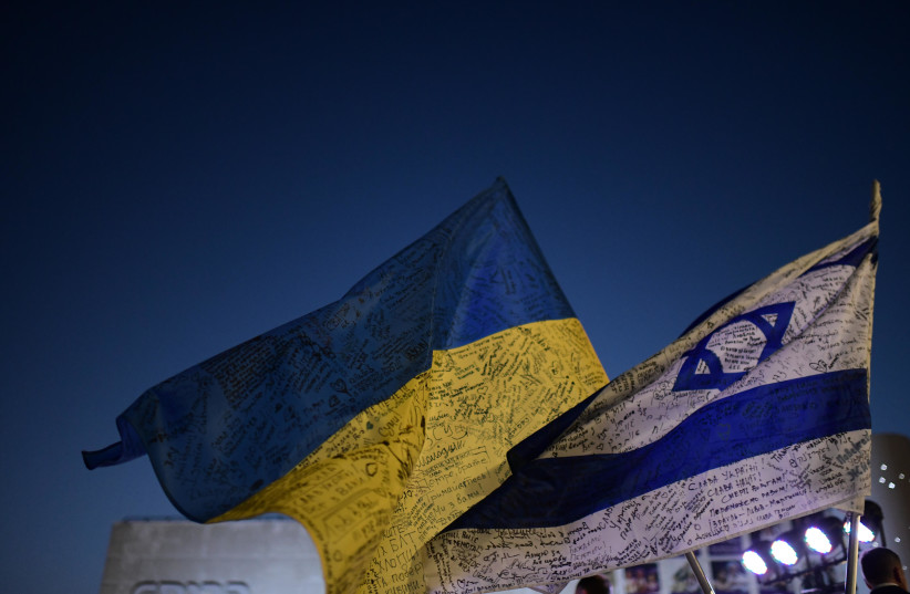  People carry placards and flags during a ceremony for Ukraine independence day and a protest against the Russian invasion to the Ukraine in Tel Aviv on August 24, 2022. (photo credit: TOMER NEUBERG/FLASH90)