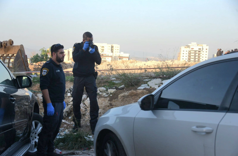  Police officers at the scene of a criminal hit in Nazareth. (photo credit: AVSHALOM SASSONI/MAARIV)