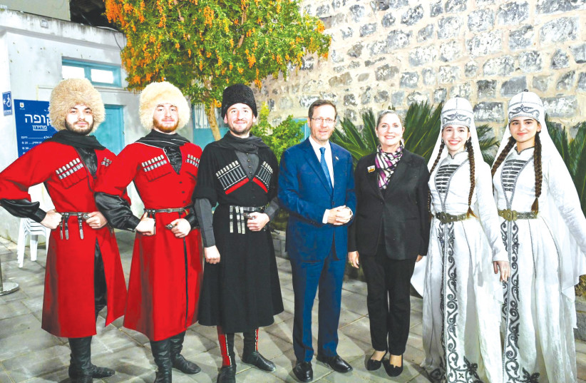  PRESIDENT ISAAC Herzog and his wife Michal with Circassian dancers at Kafr Kama.  (credit: KOBI GIDEON/GPO)
