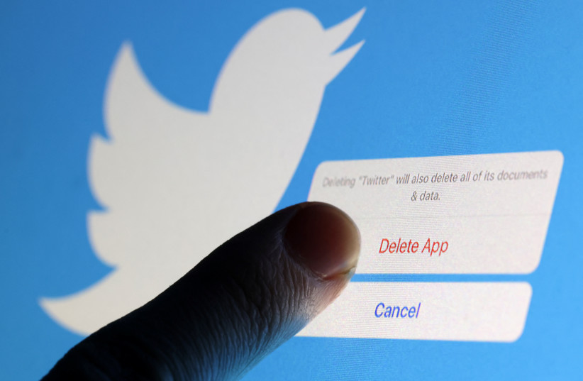  Person touch ''Delete app'' icon near Twitter logo are seen in this illustration taken, December 19, 2022. (credit: REUTERS/DADO RUVIC/ILLUSTRATION)