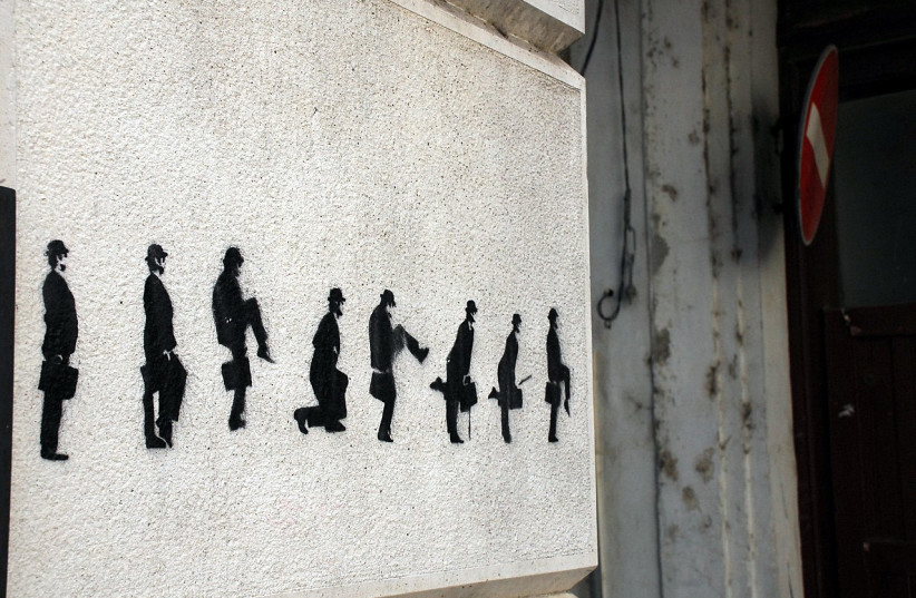  Ministry of Silly Walks street art in Porto, Portugal (Illustrative). (credit: Wikimedia Commons)