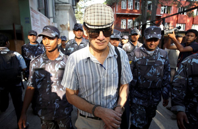  French serial killer Charles Sobhraj leaves Kathmandu district court after his hearing in Kathmandu May 31, 2011. (photo credit: REUTERS)