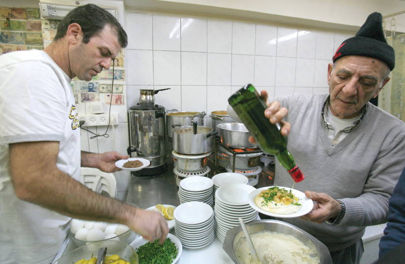  SERVING UP homestyle food in the shuk’s famous Azura eatery. (photo credit: NATI SHOHAT/FLASH90)