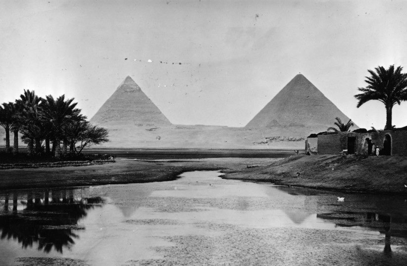  EGYPTIAN GOD: The banks of the River Nile, host to the Pyramids of Giza, 1900.  (photo credit: Hulton Archive/Getty Images)