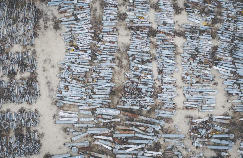  MORE THAN a thousand missiles and rockets fired by Russian forces and collected by the Kharkiv prosecutors office to be included in future war crimes investigations are seen at a cataloging depot last week, in Kharkiv, Ukraine.  (photo credit: Chris McGrath/Getty Images)