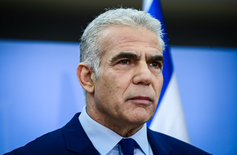  Israeli Prime Minister and Head of the Yesh Atid party Yair Lapid holds a press conference in Tel Aviv on December 22, 2022.  (photo credit: TOMER NEUBERG/FLASH90)