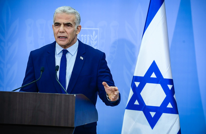  Israeli Prime Minister and Head of the Yesh Atid party Yair Lapid holds a press conference in Tel Aviv on December 22, 2022.  (credit: TOMER NEUBERG/FLASH90)