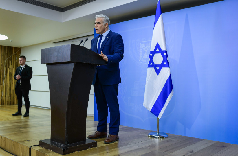 Israeli Prime Minister and Head of the Yesh Atid party Yair Lapid holds a press conference in Tel Aviv on December 22, 2022.  (credit: TOMER NEUBERG/FLASH90)