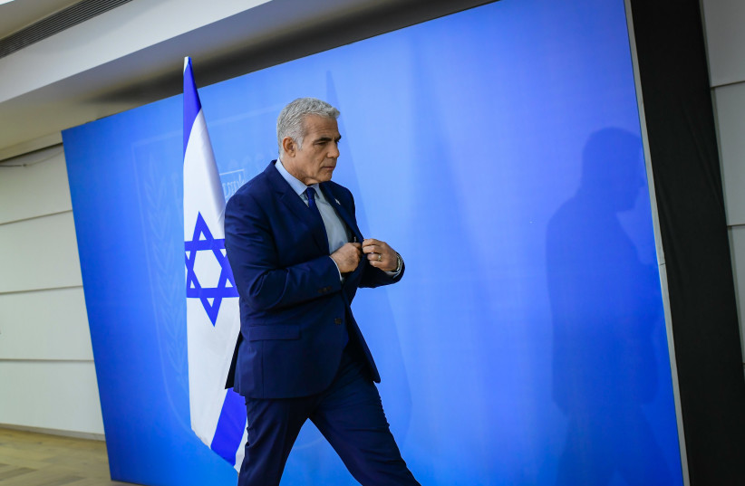  Israeli Prime Minister and Head of the Yesh Atid party Yair Lapid holds a press conference in Tel Aviv on December 22, 2022 (credit: TOMER NEUBERG/FLASH90)