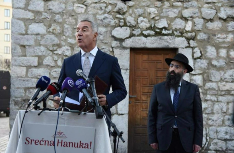 Montenegro's Chief Rabbi Ari Edelkopf listens as President Milo Đukanović addresses the Hanukkah celebrations in Podgorica, Dec. 21, 2022. (credit: CHABAD)
