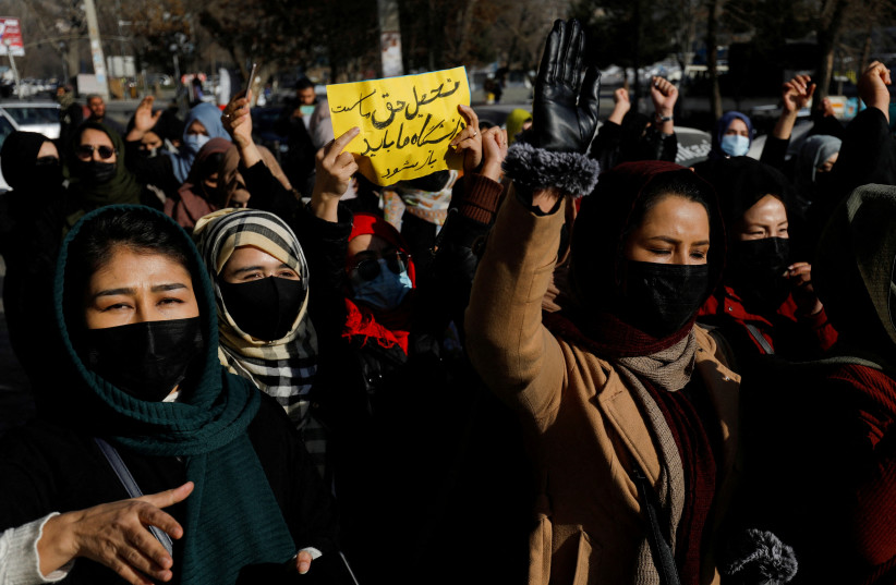 Afghan women chant slogans in protest against the closure of universities to women by the Taliban in Kabul, Afghanistan, December 22, 2022. (credit: REUTERS/STRINGER)