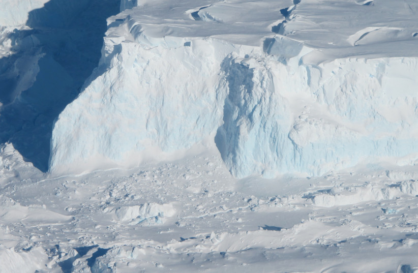 A close look at the Thwaites Ice Shelf edge as seen from the IceBridge DC-8 on Oct. 16, 2012. The blue areas of ice are denser, compressed ice. (credit: NASA ICE/PUBLIC DOMAIN/VIA WIKIMEDIA COMMONS)