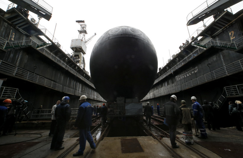 People attend a ceremony launching the diesel-electric submarine "Rostov-on-Don" at the Admiralty Shipyards in St. Petersburg, June 26, 2014. "Rostov-on-Don" produced under Project 636.3 is the second serial submarine being built by OJSC Admiralty Shipyards for Russia's Black Sea Fleet. (photo credit: REUTERS/ALEXANDER DEMIANCHUK)