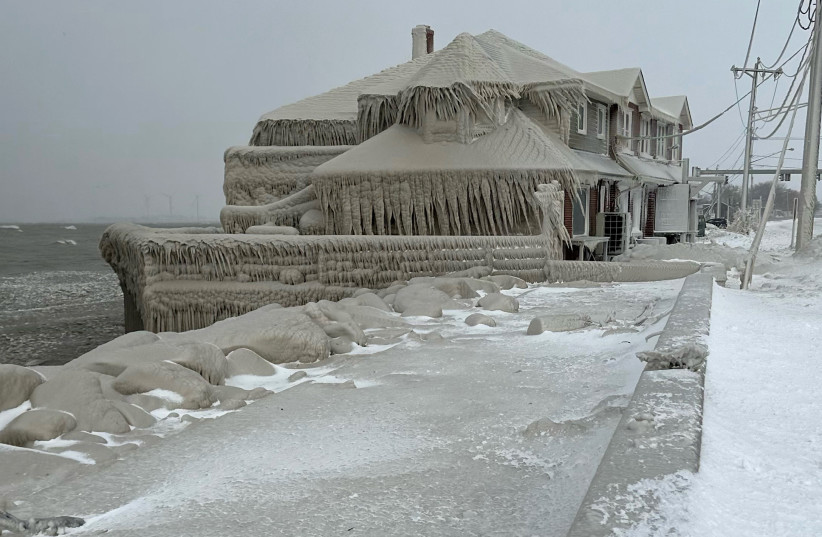  Hoak's restaurant is covered in ice from the spray of Lake Erie waves during a winter storm that hit the Buffalo region in Hamburg, New York, US, December 24, 2022.  (credit: Kevin Hoak/ via Reuters)