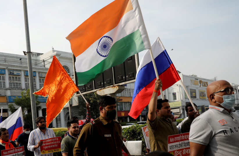  Activists of Hindu Sena, a Hindu right-wing group, hold placards and flags as they take part in a march in support of Russia, as the invasion of Ukraine continues, in Connaught Place, in New Delhi, India, March 6, 2022. (credit: REUTERS/ANUSHREE FADNAVIS)