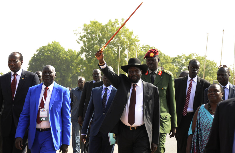 South Sudan's President Salva Kiir (C) acknowledges his supporters as he arrives to address a rally at John Garang's Mausoleum in the capital Juba March 18, 2015, on the peace talks process with South Sudan's rebel leader Riek Machar. Fighting since December 2013 has reopened ethnic fault lines. (credit: REUTERS/JOK SOLOMUN)