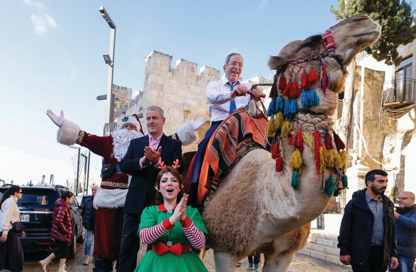  US AMBASSADOR Tom Nides on a Christmas camel, outside the Old City of Jerusalem (photo credit: MARC ISRAEL SELLEM/THE JERUSALEM POST)
