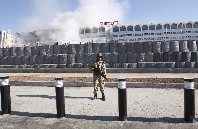  A Pakistani paramilitary soldier stands guard in front of the Marriott in Islamabad (credit: REUTERS)