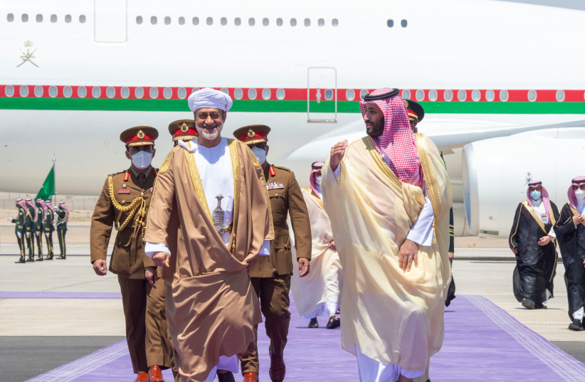 Saudi Crown Prince Mohammed Bin Salman receives Oman's Sultan Haitham bin Tariq, at Neom airport, Saudi Arabia, July 11, 2021. (credit: BANDAR ALGALOUD/COURTESY OF SAUDI ROYAL COURT/HANDOUT VIA REUTERS)