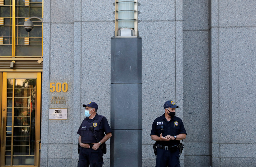 Guards wearing protective face masks stand outside the Manhattan Federal Court, New York City, New York, US, August 20, 2020. (credit: REUTERS/ANDREW KELLY)