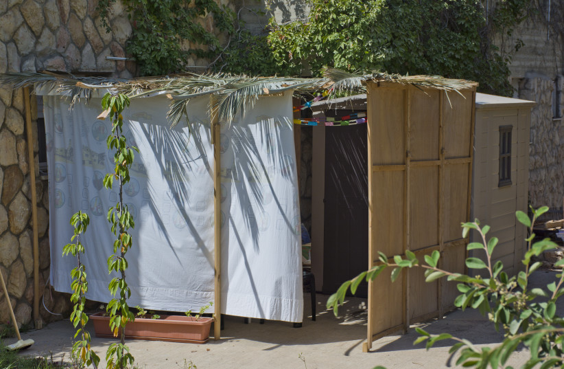 A sukkah (photo credit: ZACHI EVENOR/CC BY 2.0 (https://creativecommons.org/licenses/by/2.0)/VIA WIKIMEDIA COMMONS)