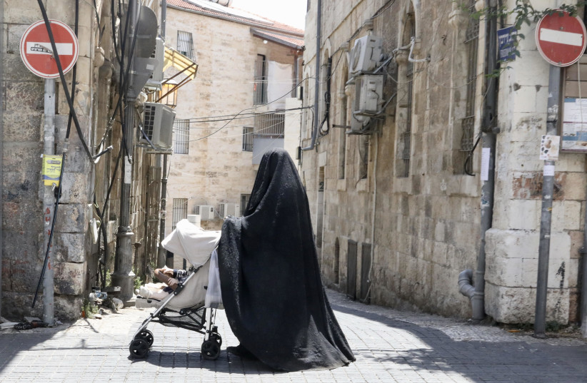  Not the Taliban, but a Jewish woman wearing a ‘Haredi burka,’ in Jerusalem. August 2022 (credit: MARC ISRAEL SELLEM/THE JERUSALEM POST)