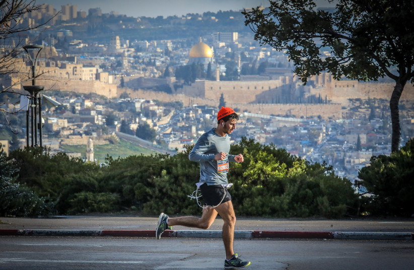  Keep on running. The Jerusalem Marathon. March 2022. (credit: MARC ISRAEL SELLEM/THE JERUSALEM POST)