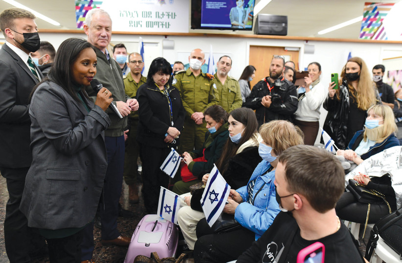  NEW JOURNEY: Aliyah and Integration Minister Pnina Tamano-Shata (with Benny Gantz at her right) welcomes Ukranian war refugees, at Ben-Gurion Airport last year. (photo credit: TOMER NEUBERG/FLASH90)