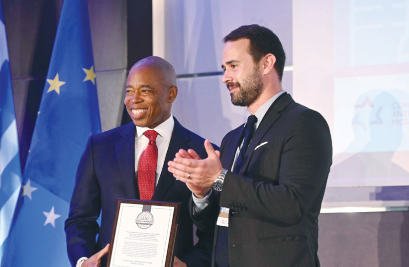  THE WRITER presents New York City Mayor Eric Adams with the CAM Civic Leadership Award for his dedicated commitment to fighting antisemitism and religious bigotry of all forms, at the Mayors Summit Against Antisemitism in Athens. (photo credit: Georgiou Babis/Combat Antisemitism Movement)