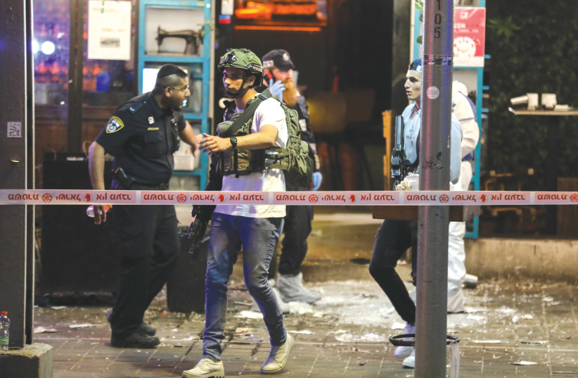  POLICE AND rescue workers at the scene of April’s terrorist attack on Dizengoff Street in Tel Aviv. (credit: NOAM REVKIN FENTON/FLASH90)