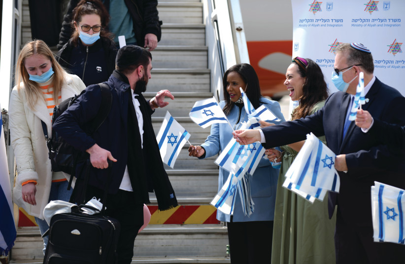 UKRAINIAN IMMIGRANTS are greeted by then-absorption minister Pnina Tamano-Shata (third right) upon their arrival at Ben-Gurion Airport in February. (photo credit: TOMER NEUBERG/FLASH90)