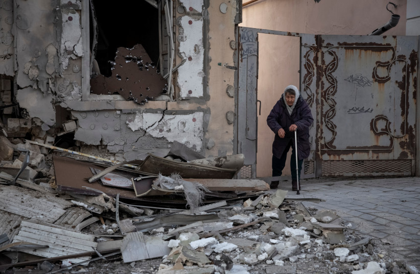  Local resident Klavdia, 82, stands near her house which was destroyed by a Russian military strike, as Russia's attack on Ukraine continues, in Kherson, Ukraine December 29, 2022. (credit: REUTERS/OLEKSANDR RATUSHNIAK)