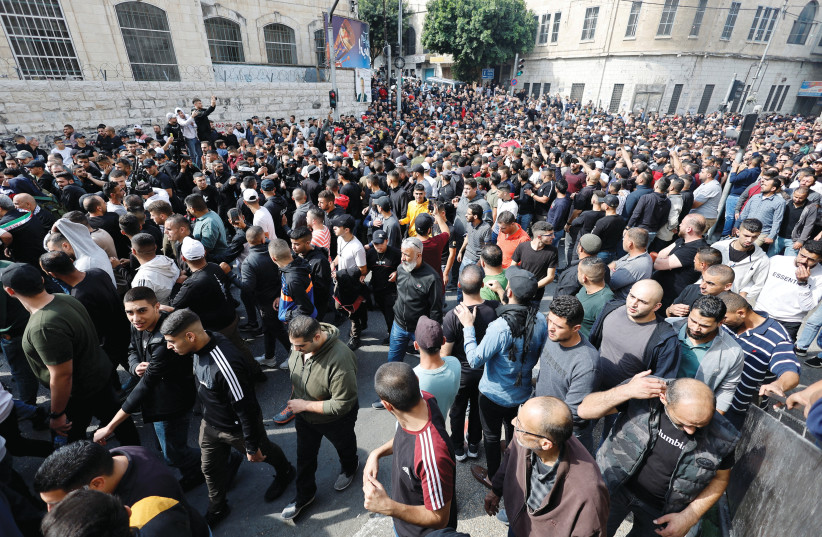  MOURNERS IN Nablus attend the funeral of Wadee Al-Houh, a member of the Palestinian renegade group Lions’ Den, in October. Al-Houh was killed during clashes with Israeli forces cracking down on terrorism. (photo credit: RANEEN SAWAFTA/ REUTERS)