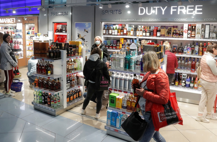  Passengers visit a duty free shop at an airport in Minsk (photo credit: REUTERS)