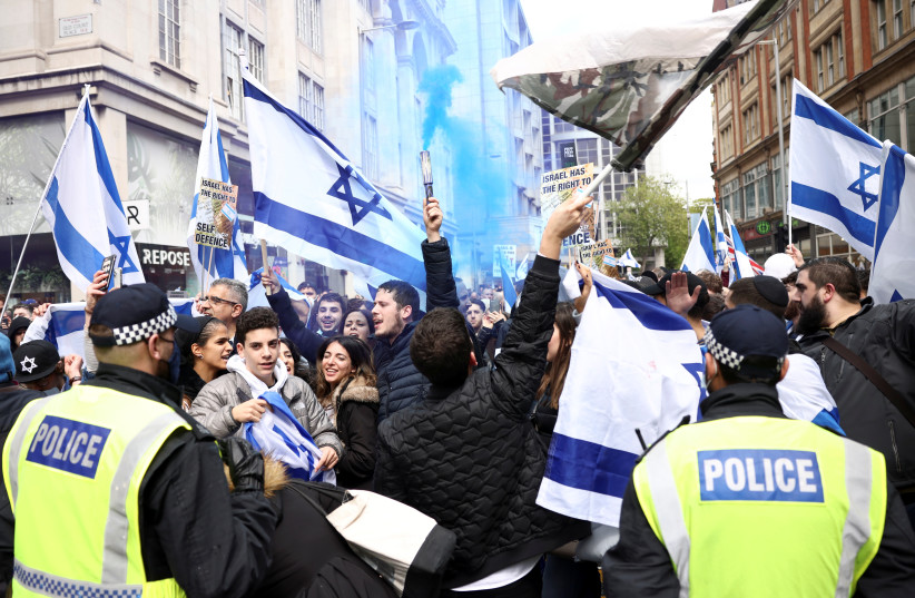  Pro-Israeli demonstrators attend a protest following a flare-up of Israeli-Palestinian violence, in London, Britain, May 23, 2021. (photo credit: ACTION IMAGES VIA REUTERS/LEE SMITH AND REUTERS/HENRY NICHOLLS)