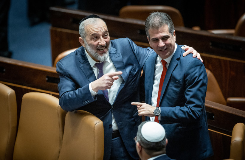 Interior and Health Minister Aryeh Deri with Foreign Minister Eli Cohen during the swearing in ceremony of the new Israeli government at the Knesset, the Israeli parliament in Jerusalem, on December 29, 2022.  (credit: YONATAN SINDEL/FLASH90)