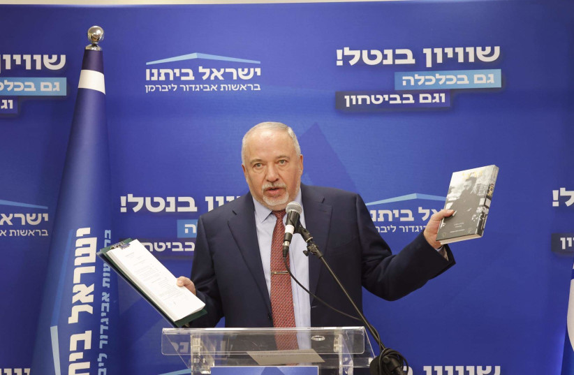  Yisrael Beytenu leader MK Avigdor Liberman is seen holding a copy of Theodor Herzl's 'The Jewish State' ahead of his faction meeting in the Israeli Knesset, in Jerusalem, on January 2, 2023. (credit: MARC ISRAEL SELLEM/THE JERUSALEM POST)