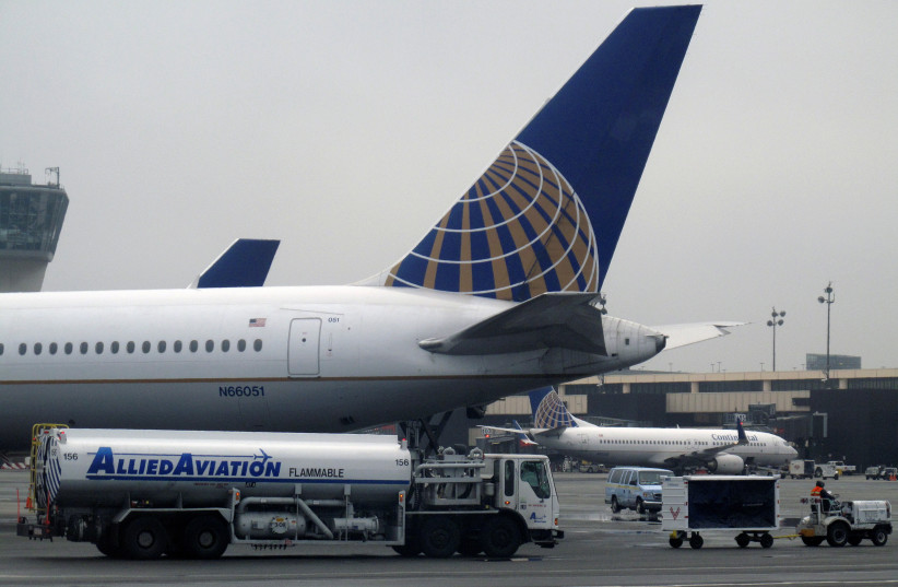  A Continental Airlines airplane is refueled at its gate at Newark Liberty International Airport in Newark, New Jersey, March 29, 2009 (credit: REUTERS/GARY HERSHORN)