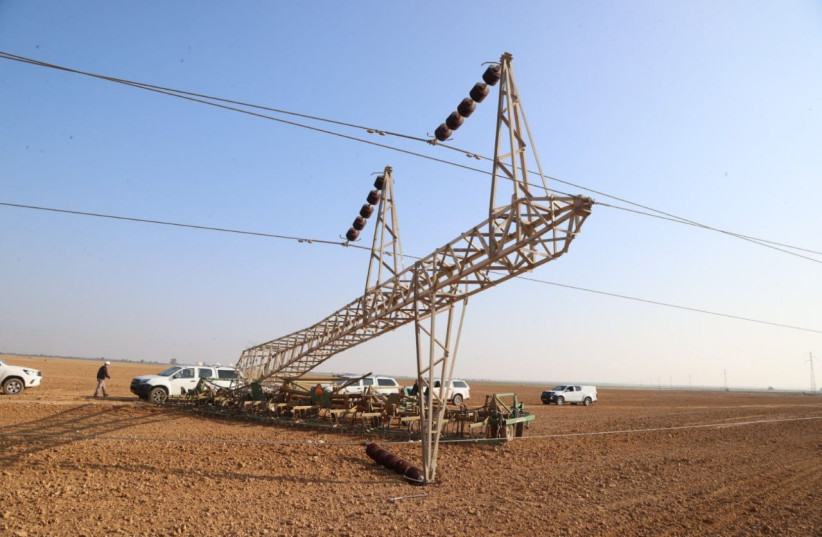  A damaged electricity pylon is seen in Ein HaBesor, southern Israel, on January 3, 2023 (credit: ISRAEL ELECTRIC COMPANY)