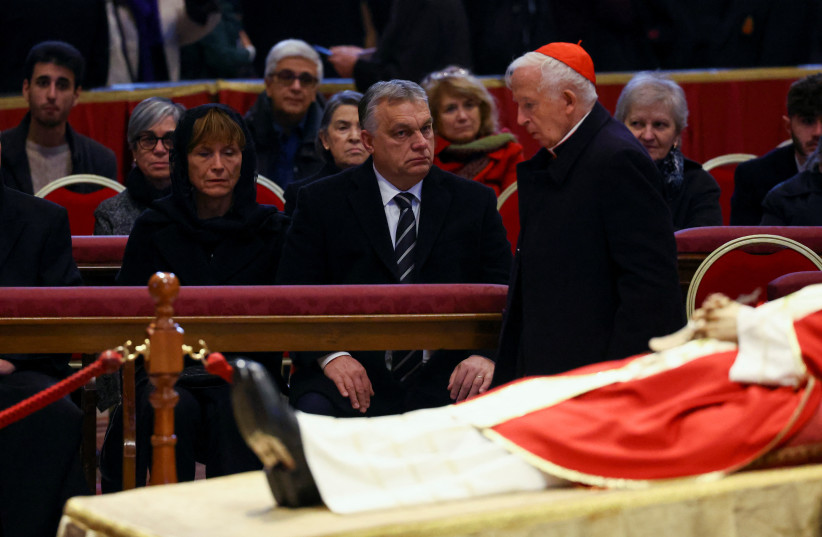  Hungarian Prime Minister Viktor Orban and faithful pay homage to former Pope Benedict, as his body lies in state at St. Peter's Basilica, at the Vatican, January 3, 2023. (credit: REUTERS/KAI PFAFFENBACH)
