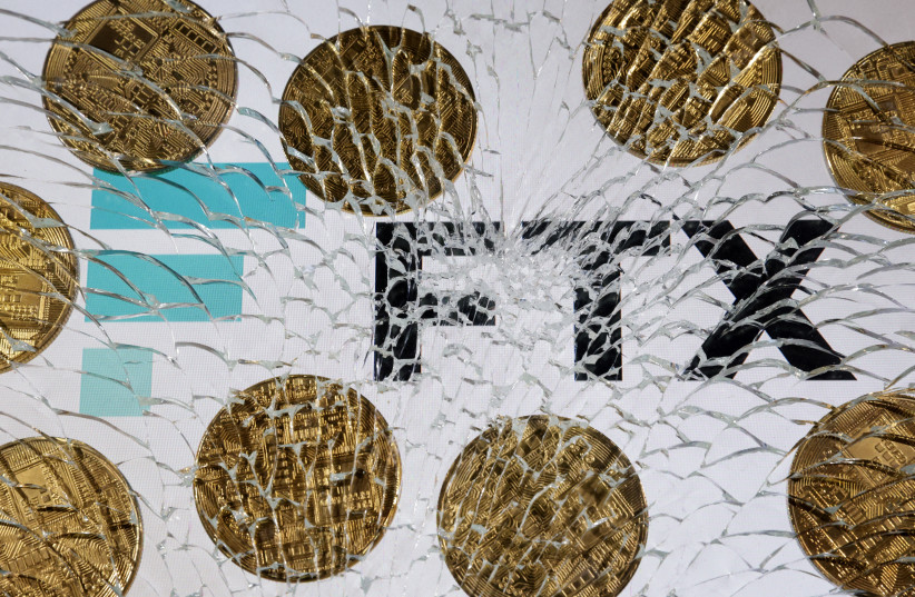  An FTX logo and a representation of cryptocurrencies are seen through broken glass in this illustration taken December 13, 2022.  (credit: REUTERS/DADO RUVIC/ILLUSTRATION)