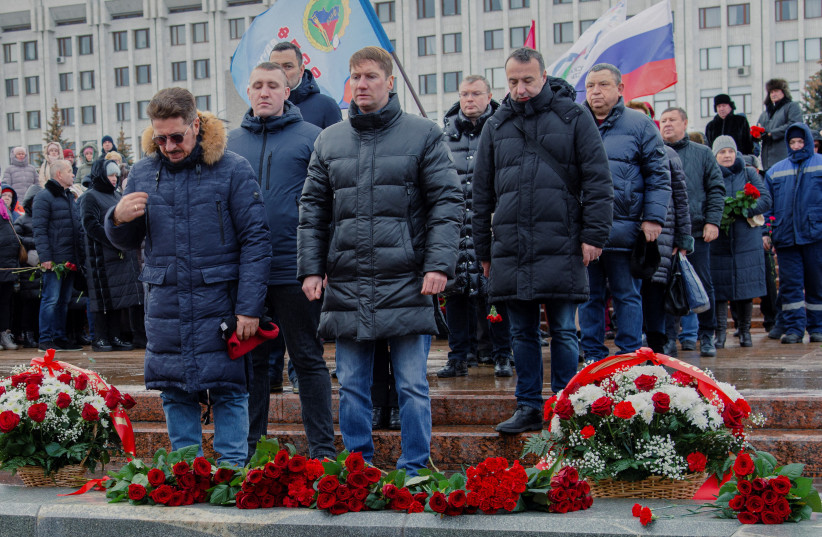  People take part in a ceremony in memory of Russian soldiers killed in the course of Russia-Ukraine military conflict, the day after Russia's Defence Ministry stated that 63 Russian servicemen were killed in a Ukrainian missile strike on their temporary accommodation in Makiivka. (credit: REUTERS/Albert Dzen)